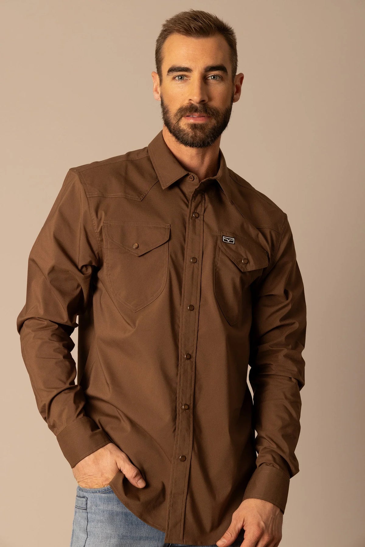 Kimes Ranch Blackout Dress Shirt in Brown with long sleeves, button front, and chest pockets with the Kimes Ranch logo