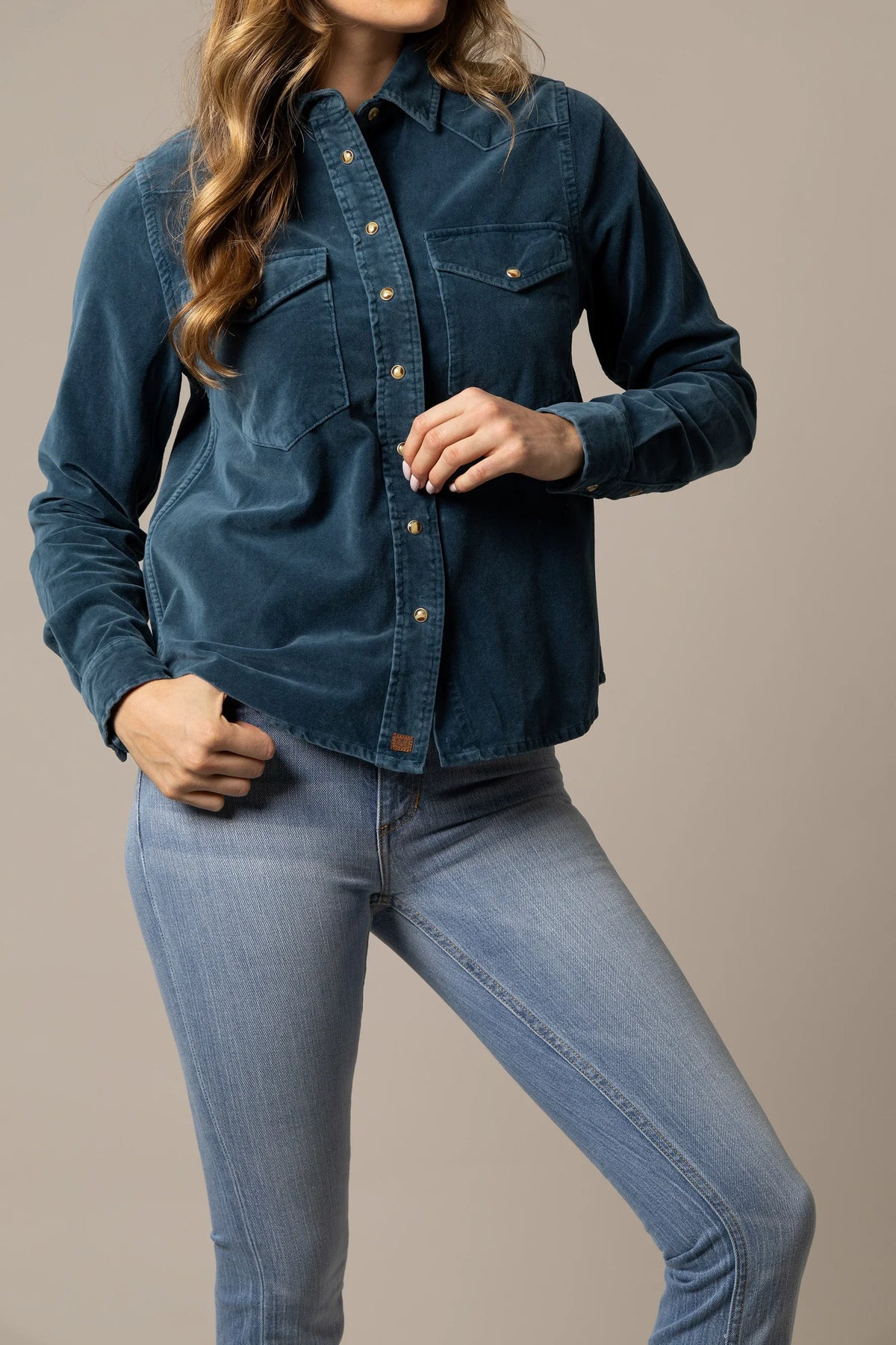 Kimes Ranch Bonnie top in Mid Blue with long sleeves, button front, and two chest pockets