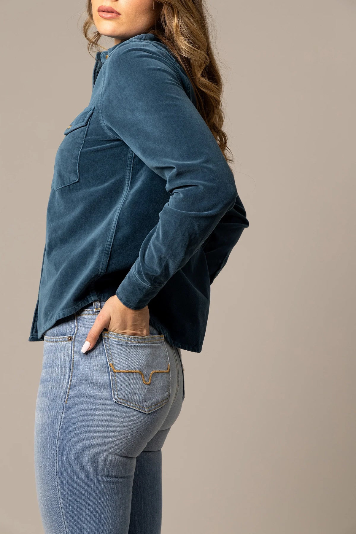 Kimes Ranch Bonnie top in Mid Blue, side view, with long sleeves and a chest pocket