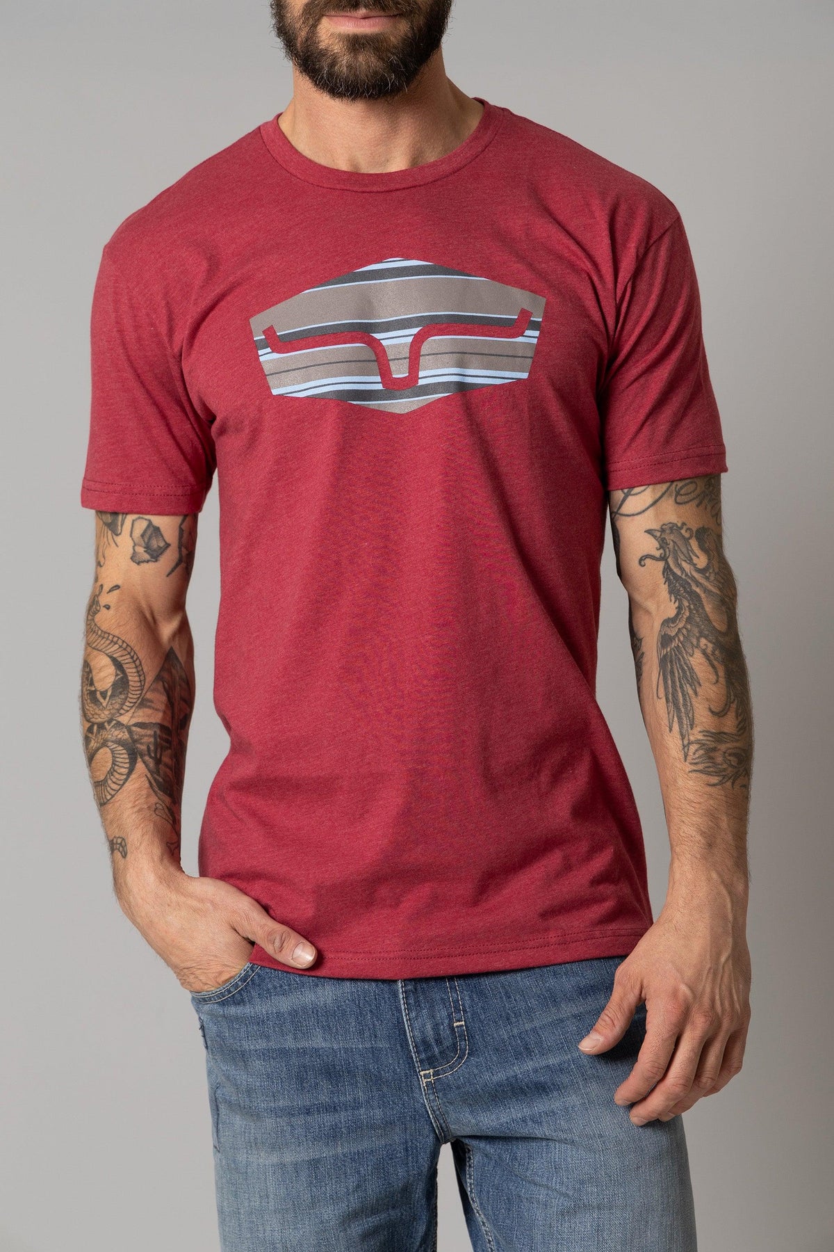Kimes Ranch Box Seats Striped shirt in Cardinal with a graphic of a stylized Kimes Ranch logo in stripes
