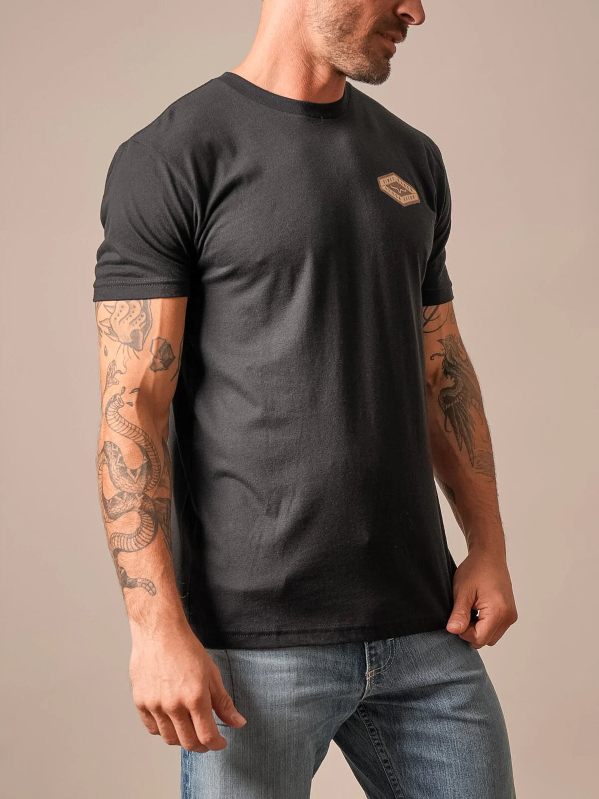 Kimes Ranch Boxer shirt in Black, side view, with short sleeves and a chest logo