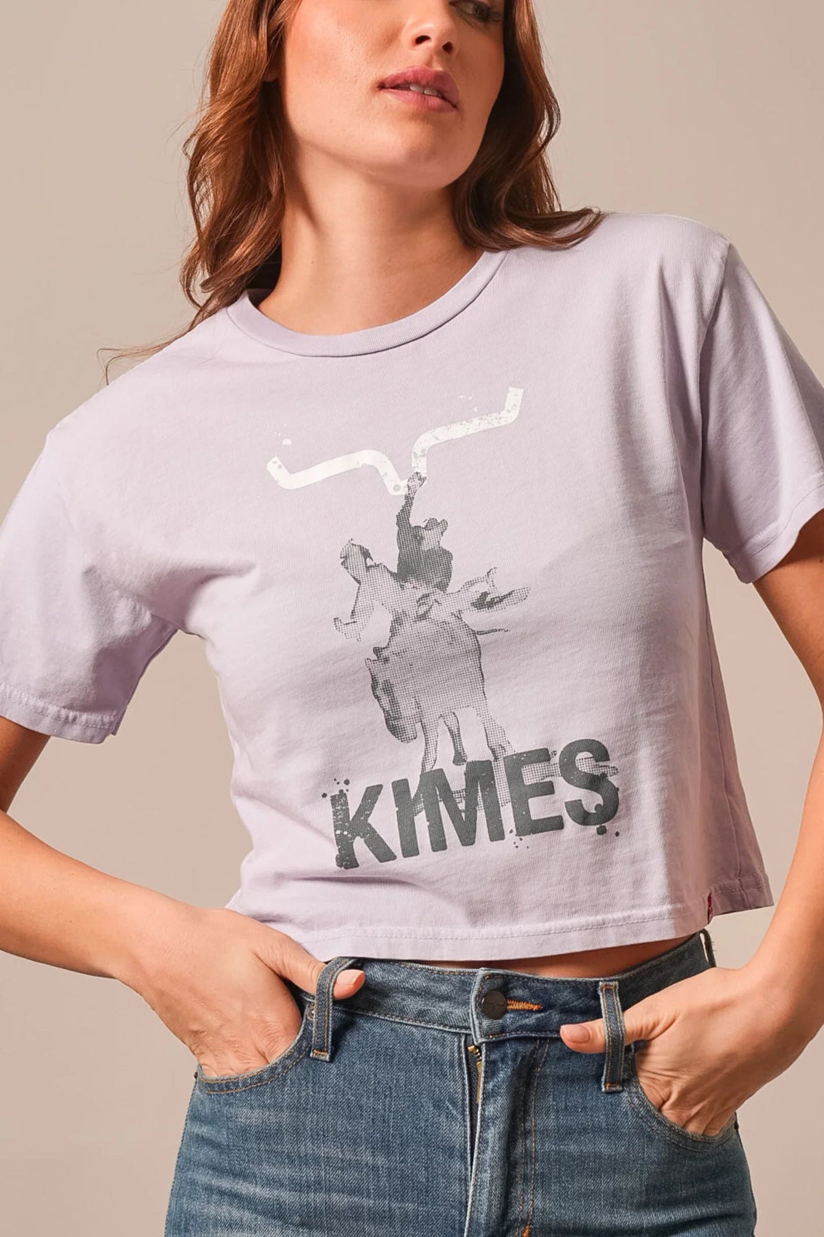 Kimes Ranch Bucks shirt in Lavender with a graphic of a cowboy on a bucking horse and the word KIMES