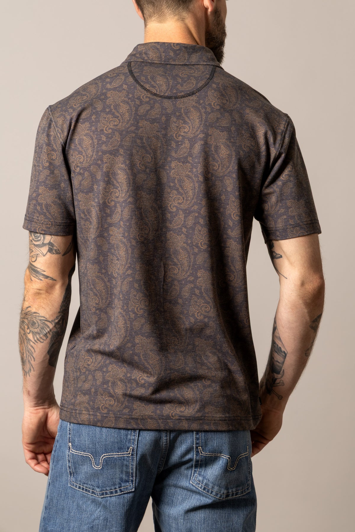 Kimes Ranch Burel polo shirt in Black, back view, with an all-over paisley print and a ribbed collar