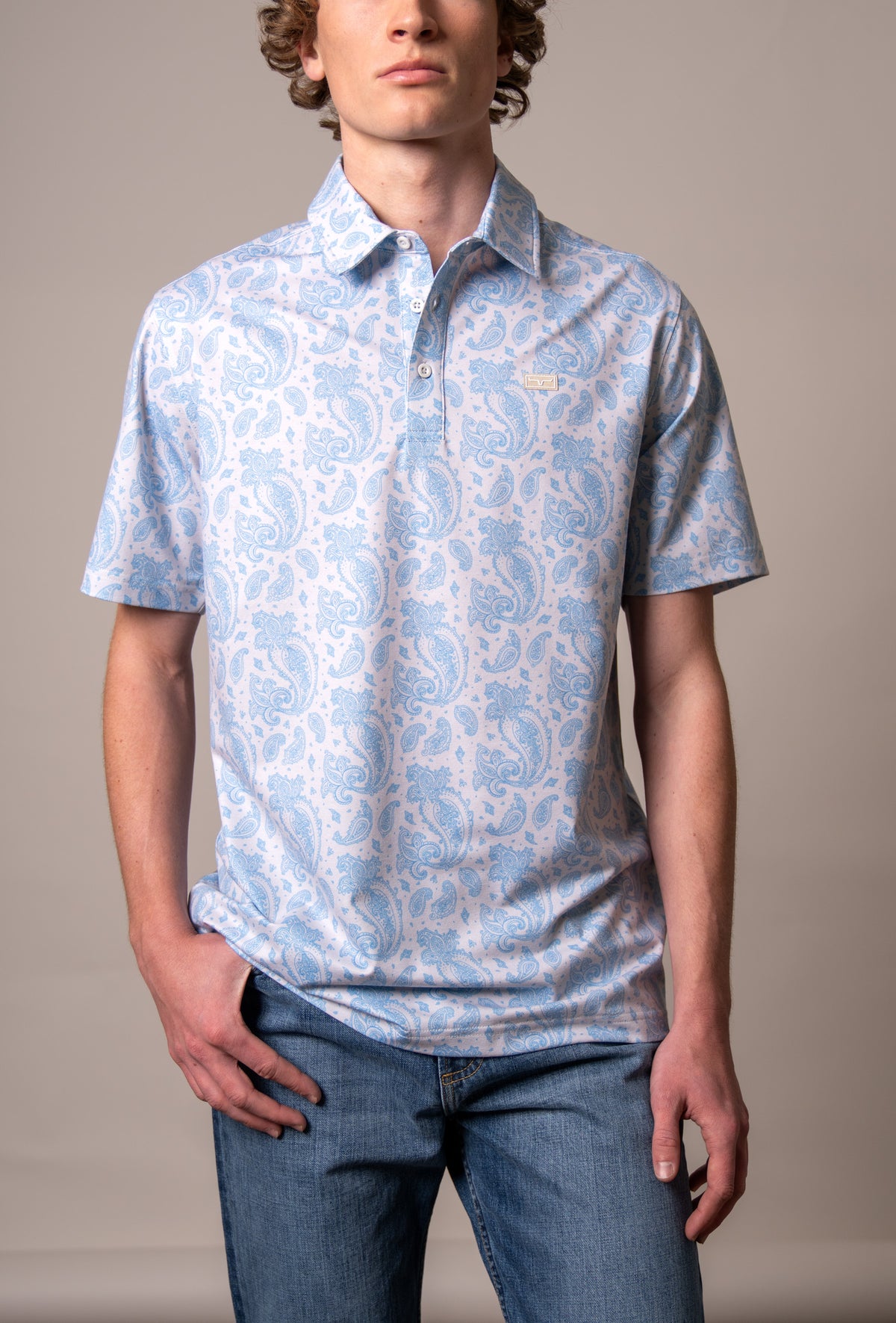 Kimes Ranch Burel polo shirt in Blue with a paisley pattern and a Kimes Ranch logo on the chest