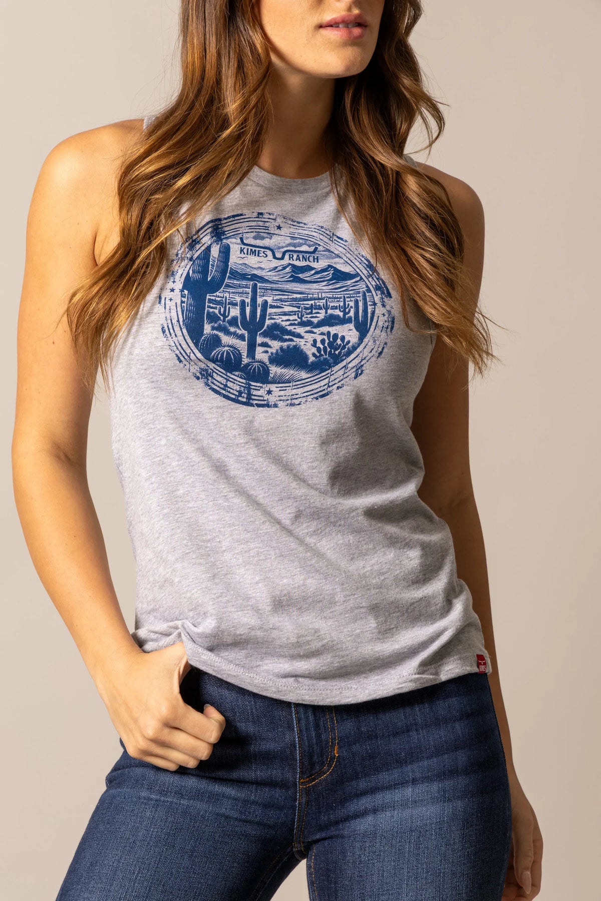Kimes Ranch Cactus Prairie shirt in Dark Grey Heather with a blue desert landscape graphic featuring cacti and mountains