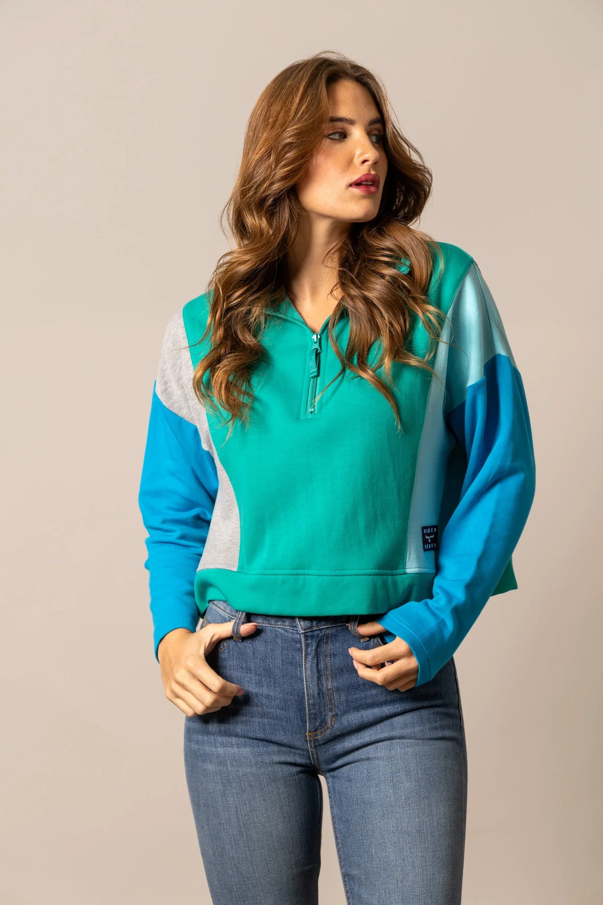 Kimes Ranch Cami Sweater in Green with colorblocked blue and grey sleeves and a front zipper
