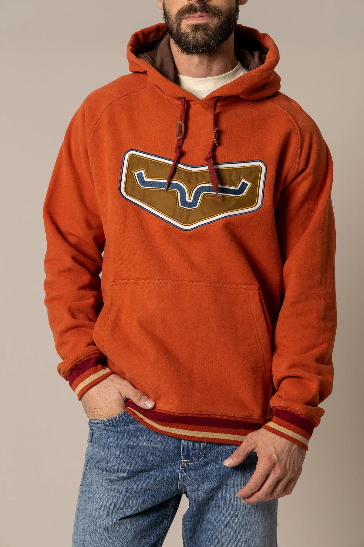Kimes Ranch Cannons Hoodie in Brick Red with a large chest graphic and striped cuffs