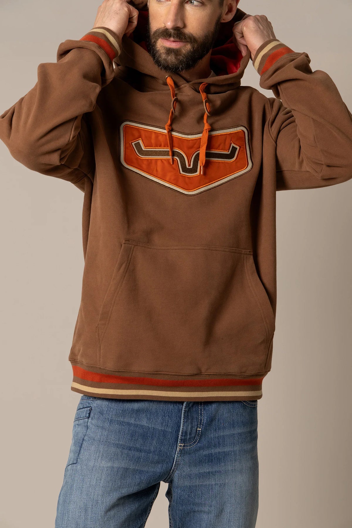 Kimes Ranch Cannons Hoodie in Brown with a large chest graphic and striped cuffs