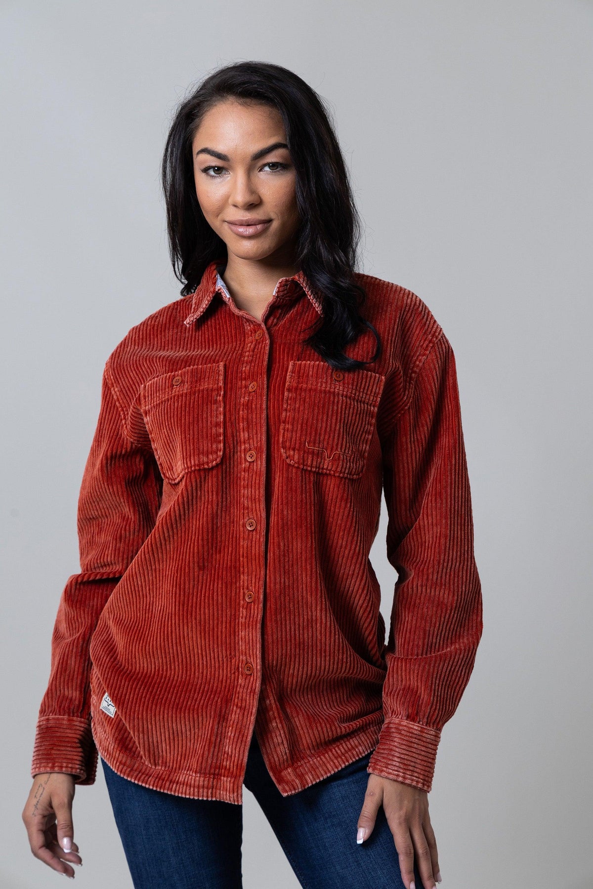 Kimes Ranch Luna Cord long sleeve button-up shirt in Rust Red with two chest pockets and a collar