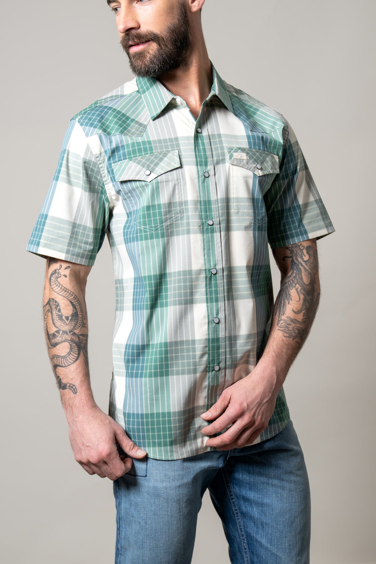 Kimes Ranch Chico dress shirt in Green with a plaid pattern and two chest pockets