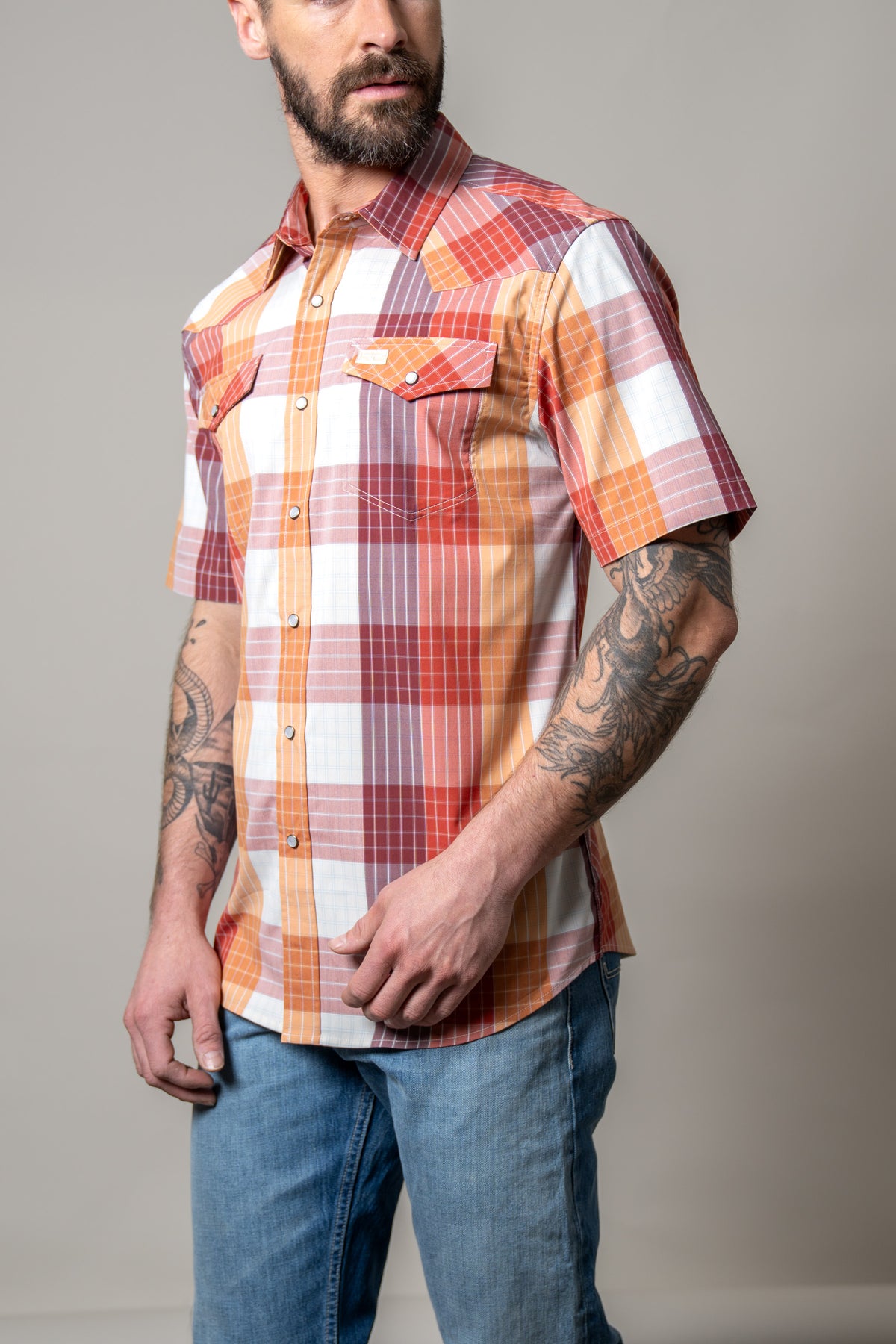 Kimes Ranch Chico short sleeve plaid dress shirt in Red, side view, with two chest pockets