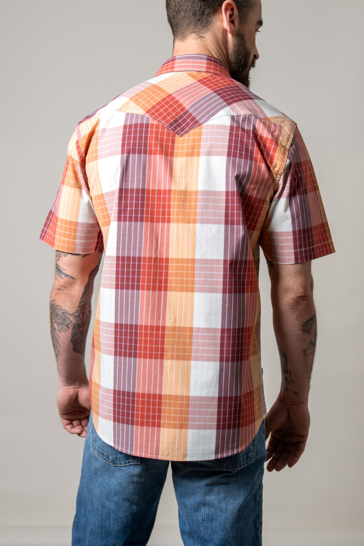 Kimes Ranch Chico dress shirt in Red, back view, with a short sleeve plaid pattern and a back yoke