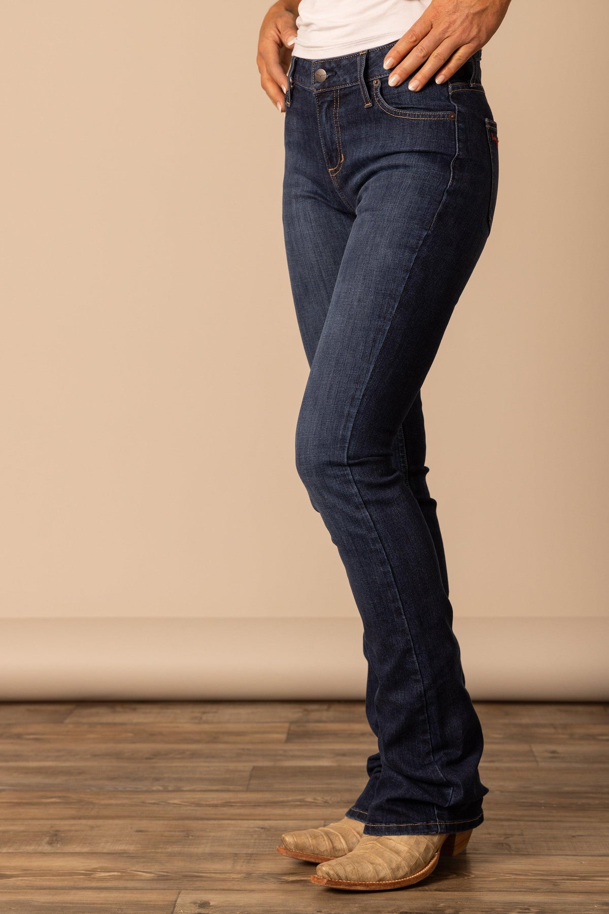 Kimes Ranch Chloe, side view, jeans in dark blue with a bootcut leg and front pockets