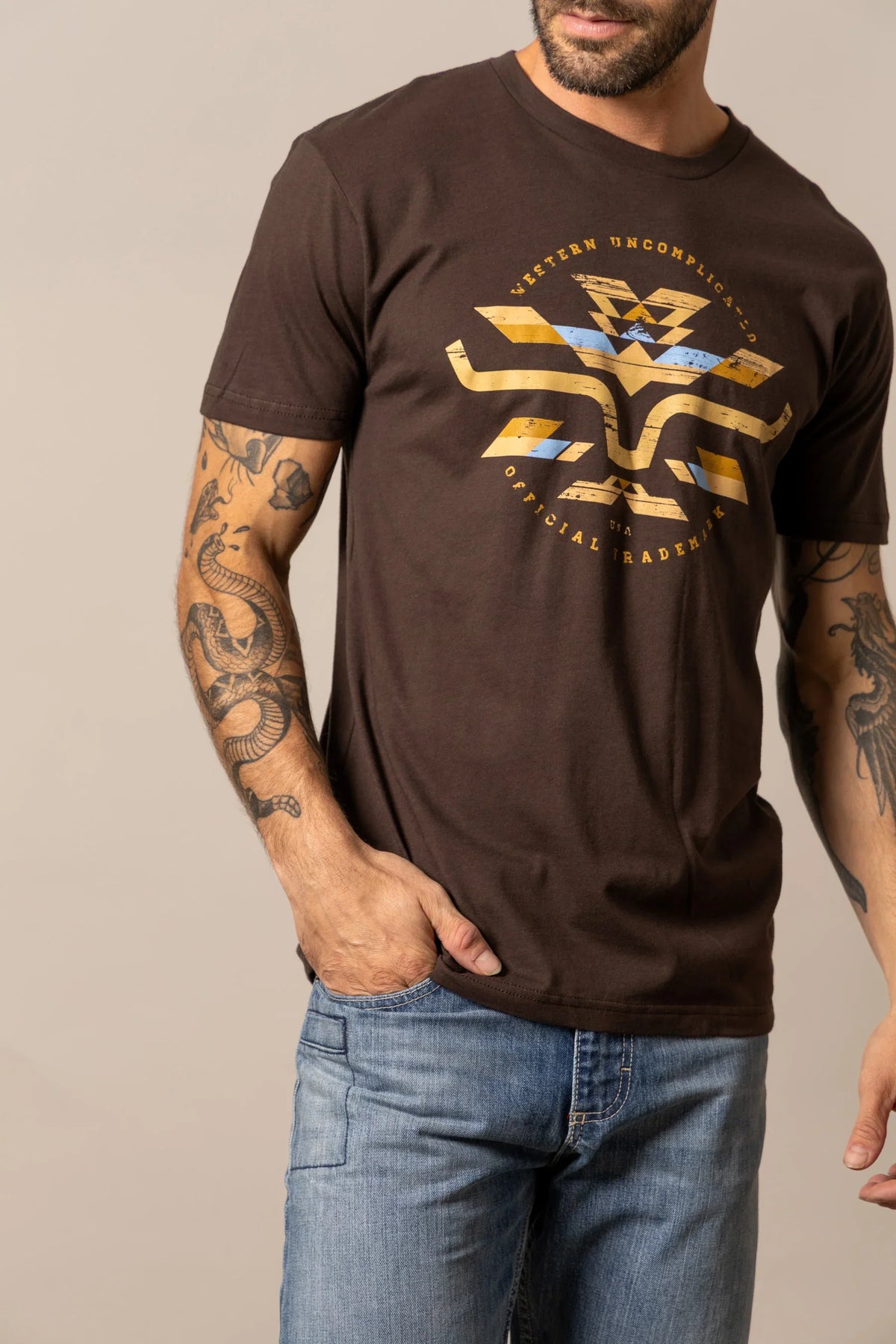 Kimes Ranch Circular Serape shirt in Dark Chocolate with a graphic print reading Western Uncomplicated Official Trademark