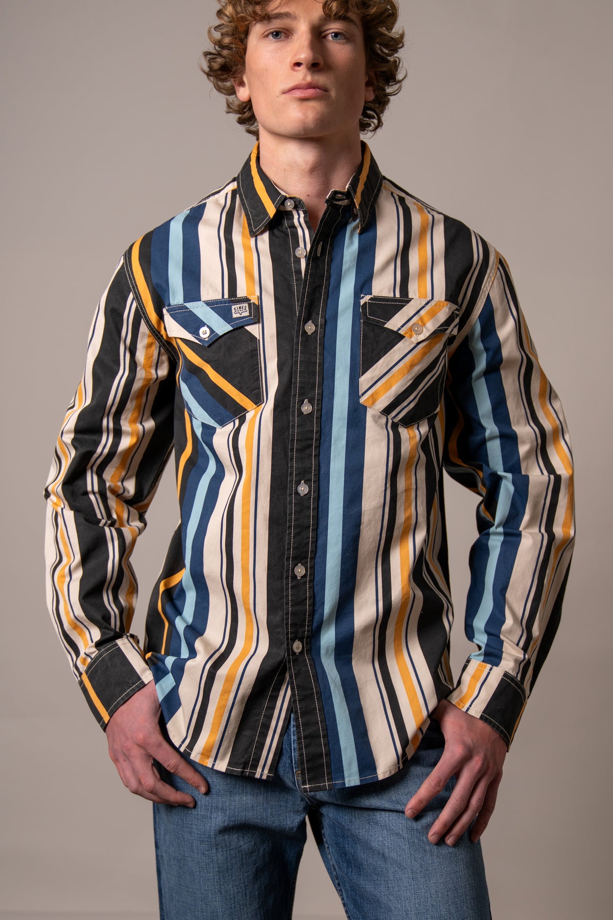 Kimes Ranch Clancy long sleeve dress shirt in Black with blue and yellow vertical stripes and two chest pockets