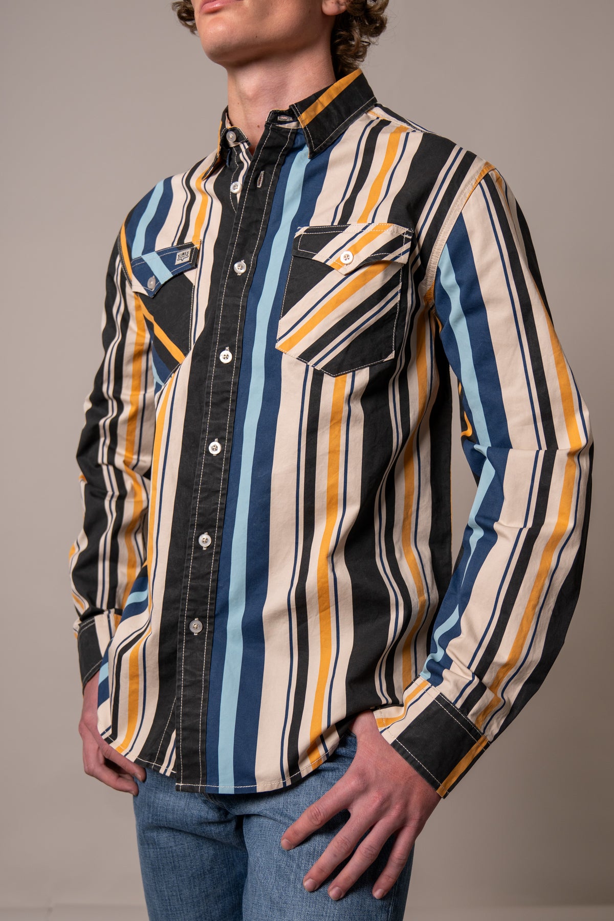 Kimes Ranch Clancy long sleeve dress shirt in Black with multi-color vertical stripes and two chest pockets