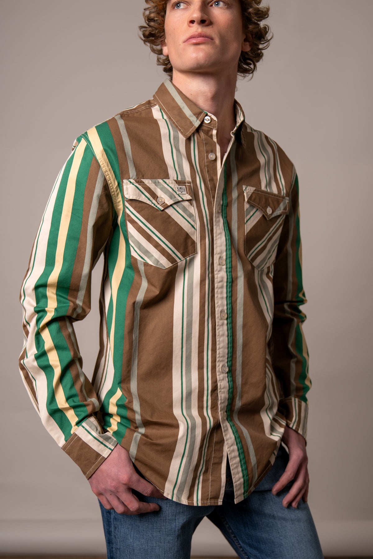 Kimes Ranch Clancy dress shirt in Brown with green and cream vertical stripes and two chest pockets