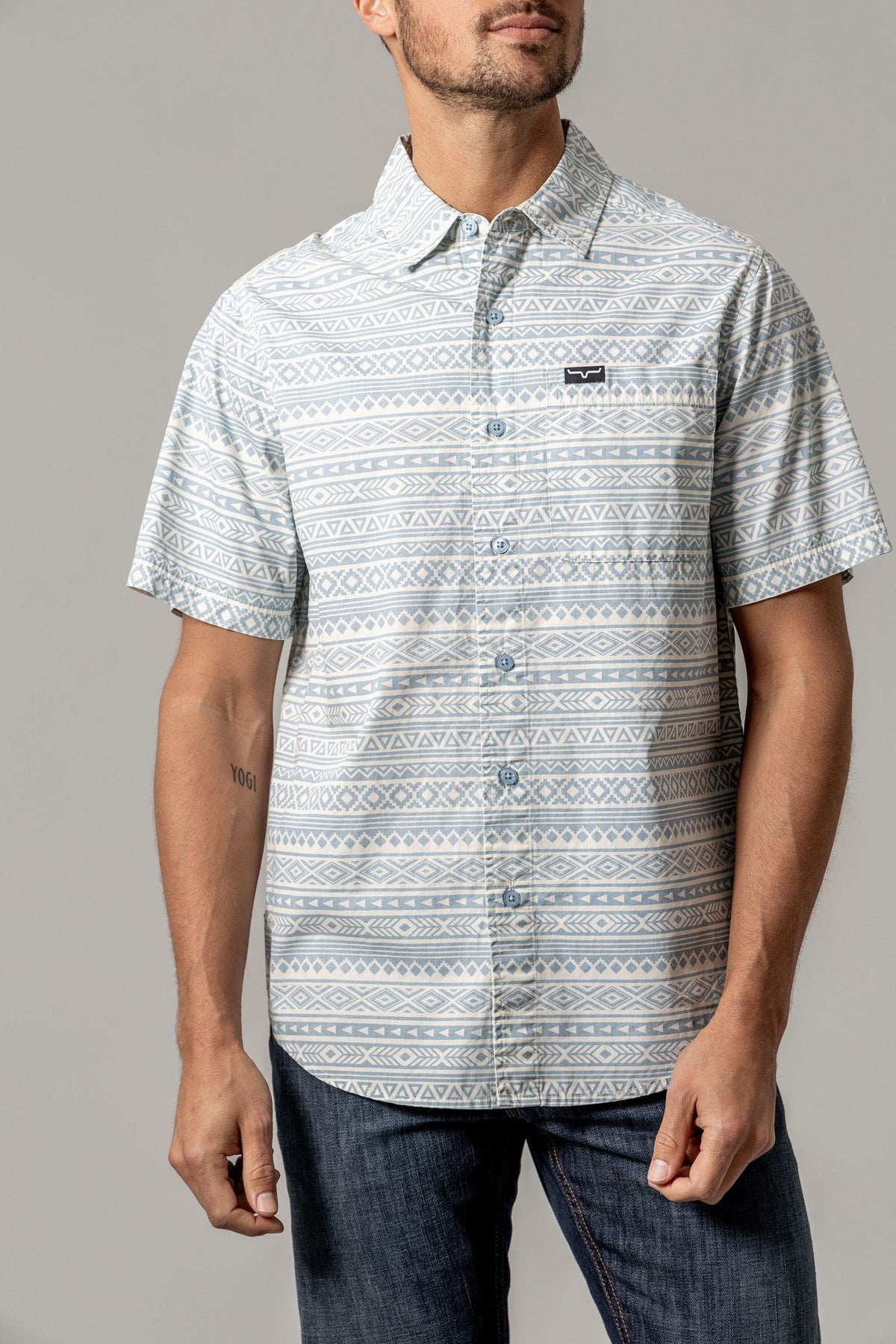 Kimes Ranch Colton short sleeve dress shirt in Light Blue with a geometric pattern and chest pocket with logo