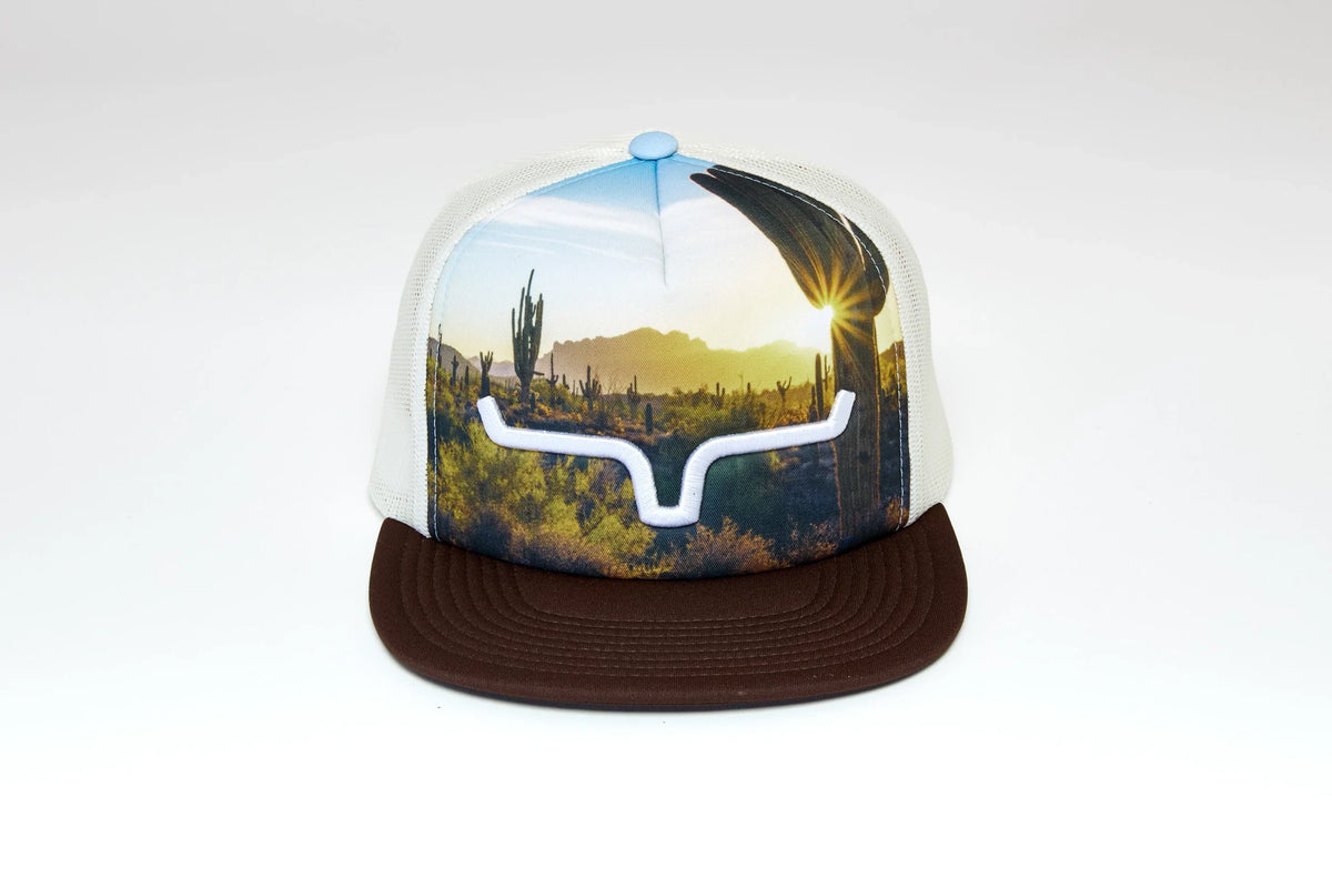 Kimes Ranch Crestview trucker hat with Brown brim and desert landscape print featuring a white Kimes Ranch logo