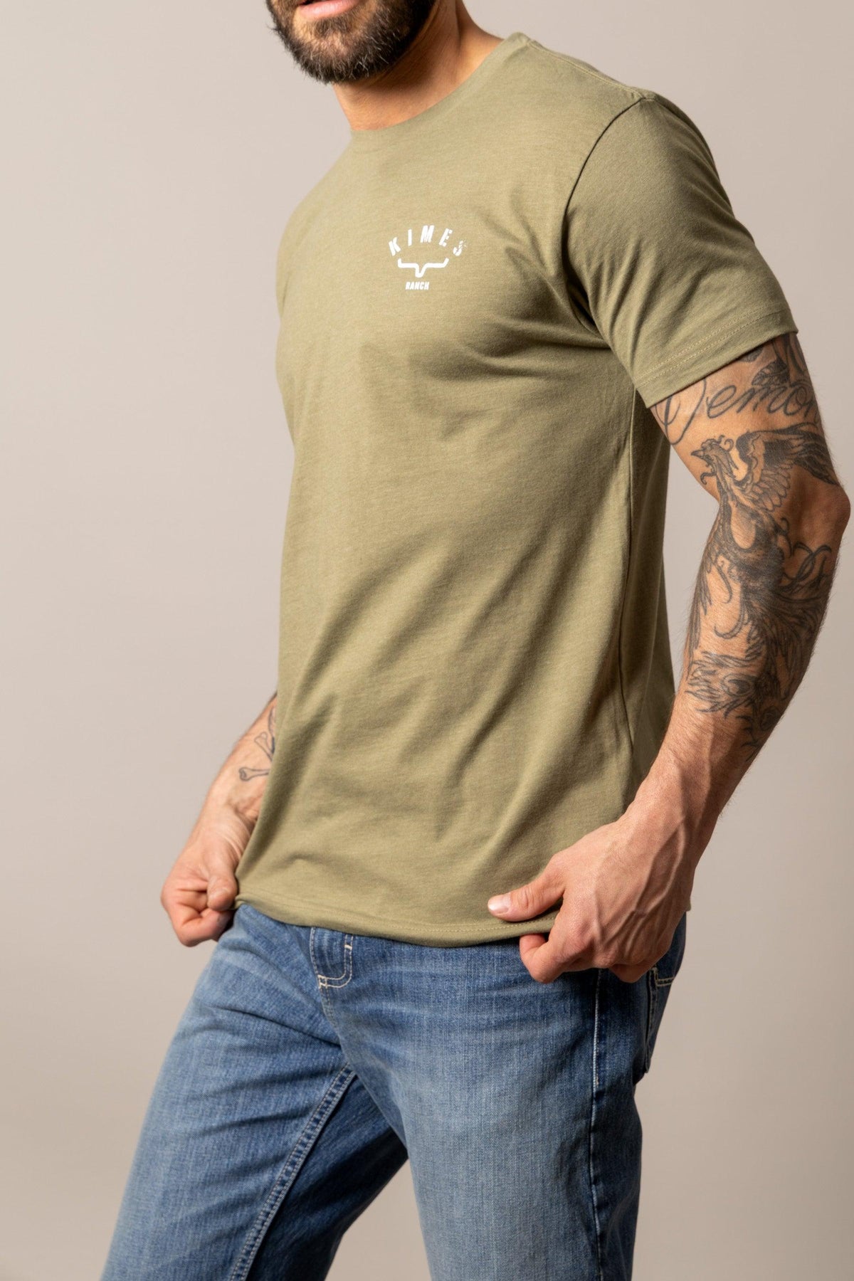 Kimes Ranch Cut Through shirt in Light Olive, side view, with a crew neck and short sleeves