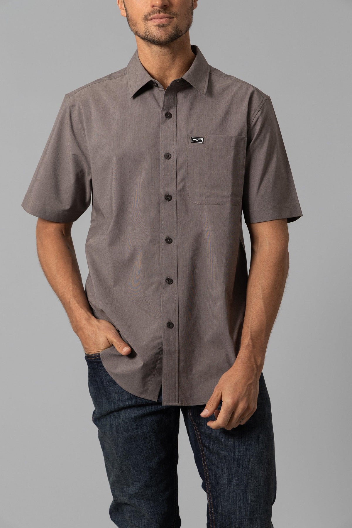 Kimes Ranch Linville Short Sleeve Dress Shirt in Brown with a chest pocket and logo patch
