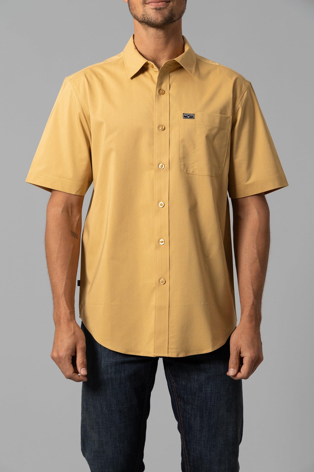Kimes Ranch Linville Short Sleeve Dress Shirt in Gold with a chest pocket and logo patch