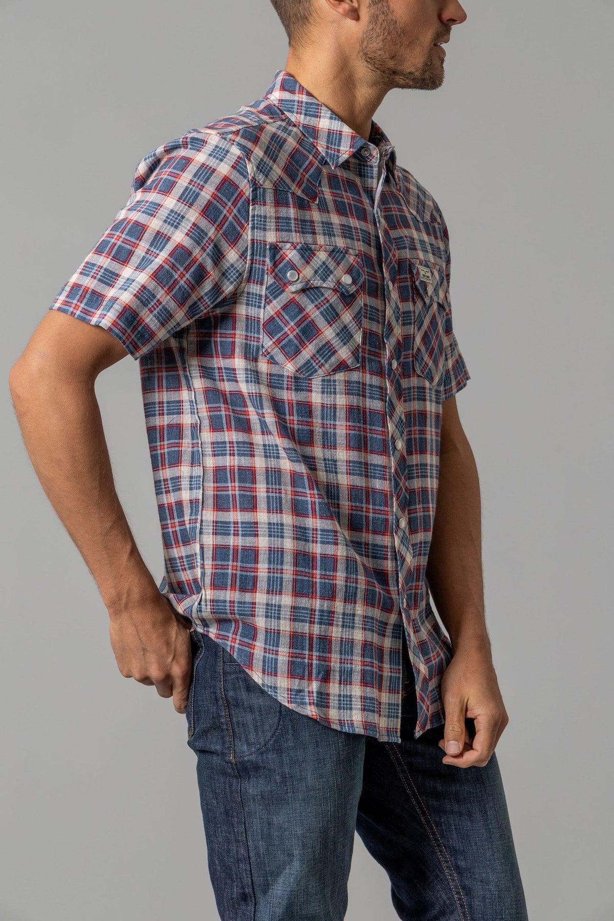 Kimes Ranch Danford short sleeve dress shirt in Blue, side view, plaid with two button flap chest pockets