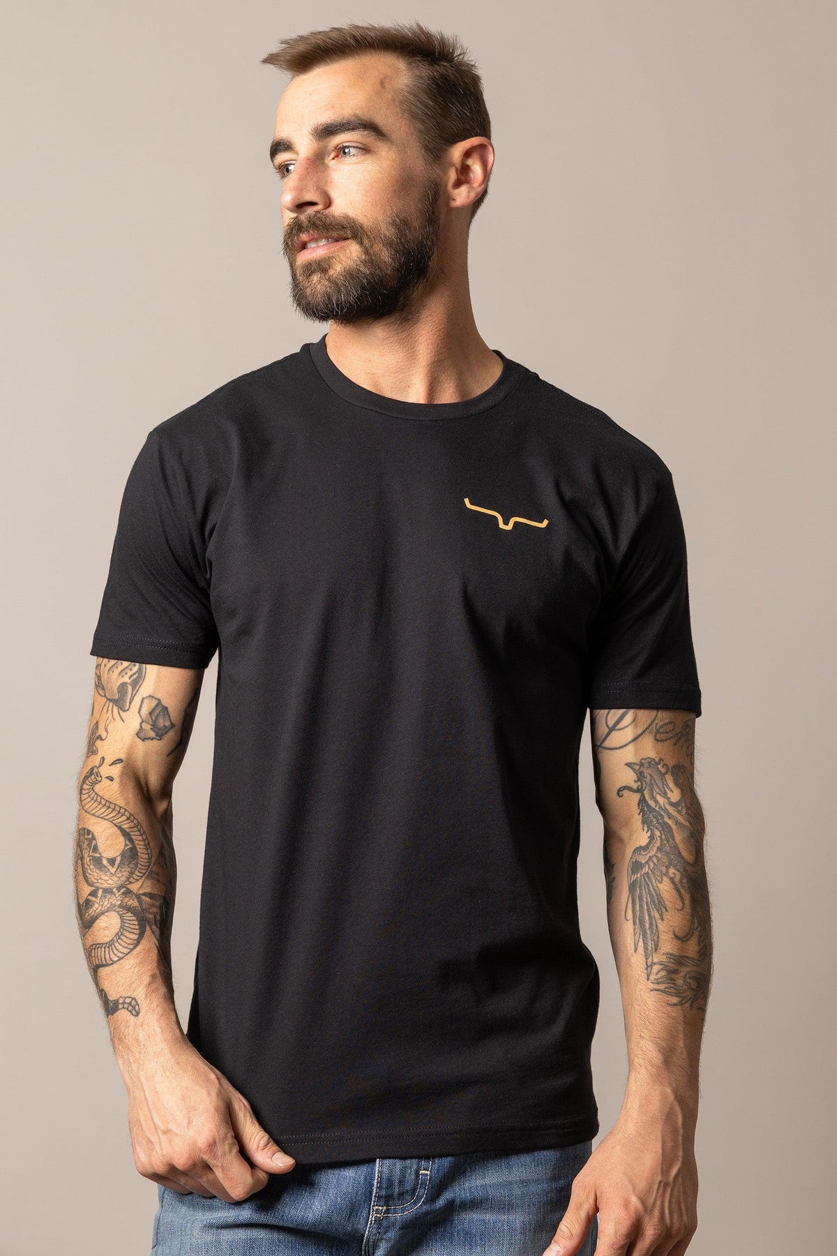 Kimes Ranch Desert Diamond Black short sleeve shirt with a gold logo on the chest