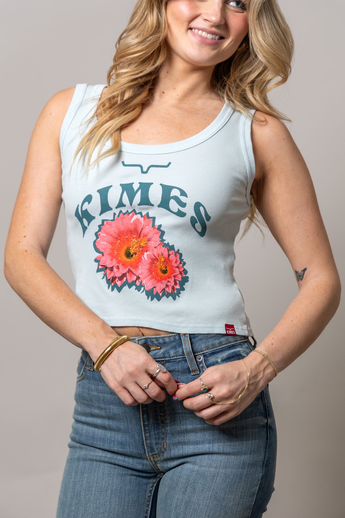 Kimes Ranch Desert Rose shirt in Ice Blue with a graphic of two pink flowers and the word KIMES