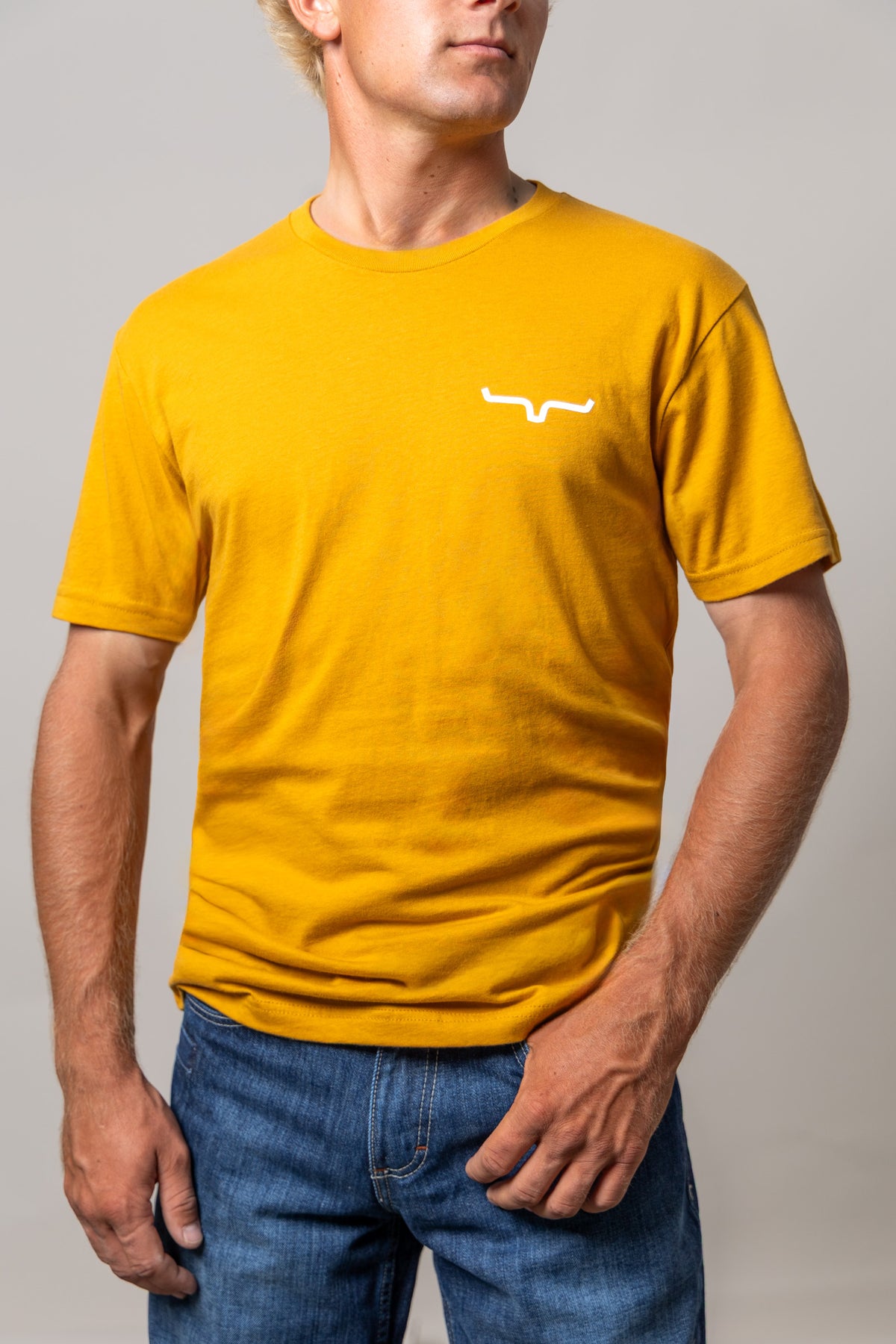 Kimes Ranch Dillard Floral shirt in Antique Gold with short sleeves and a white logo on the chest
