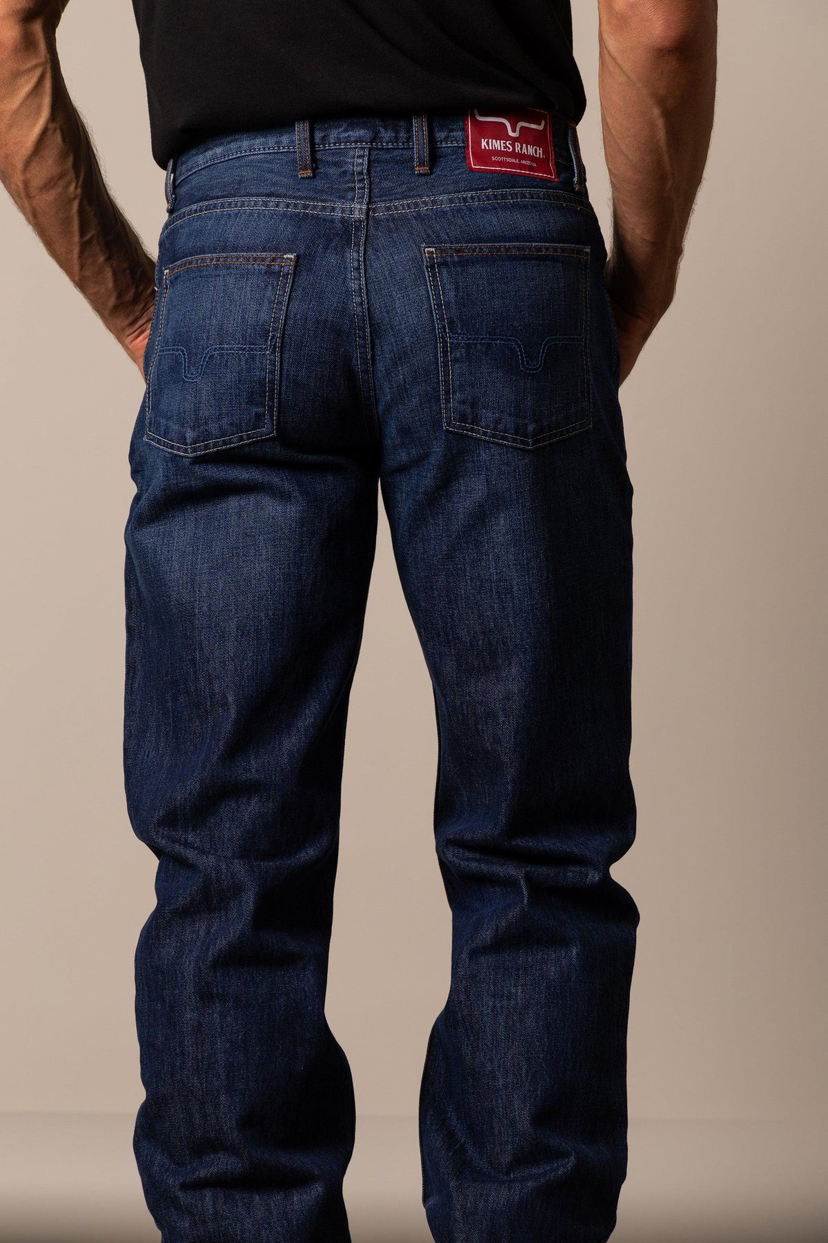 Kimes Ranch Dillon Relaxed Bootcut jeans in indigo with back pockets and a red Kimes Ranch logo patch