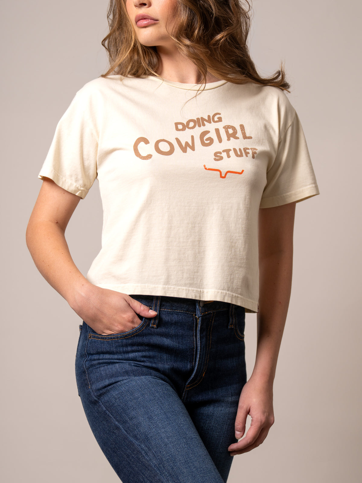 Kimes Ranch Doing Cowgirl Stuff Shirt in Ivory with short sleeves and a front graphic print