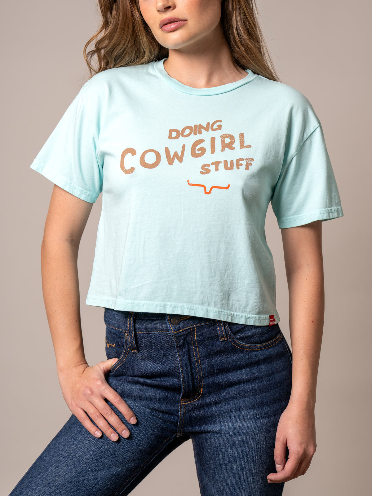 Kimes Ranch Doing Cowgirl Stuff shirt in Mint with short sleeves and a front graphic print