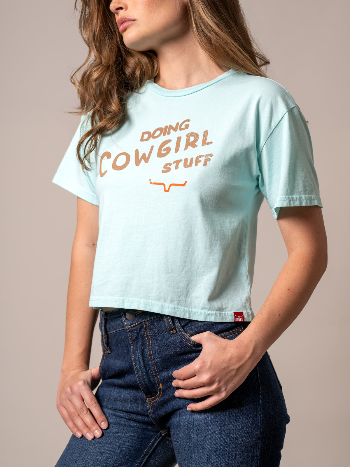 Kimes Ranch Doing Cowgirl Stuff shirt in Mint with short sleeves and a graphic print