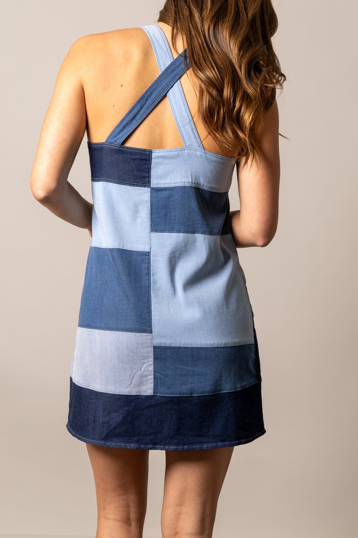 Kimes Ranch Dottie dress in Indigo, back view, with a patchwork design and a crisscross back detail