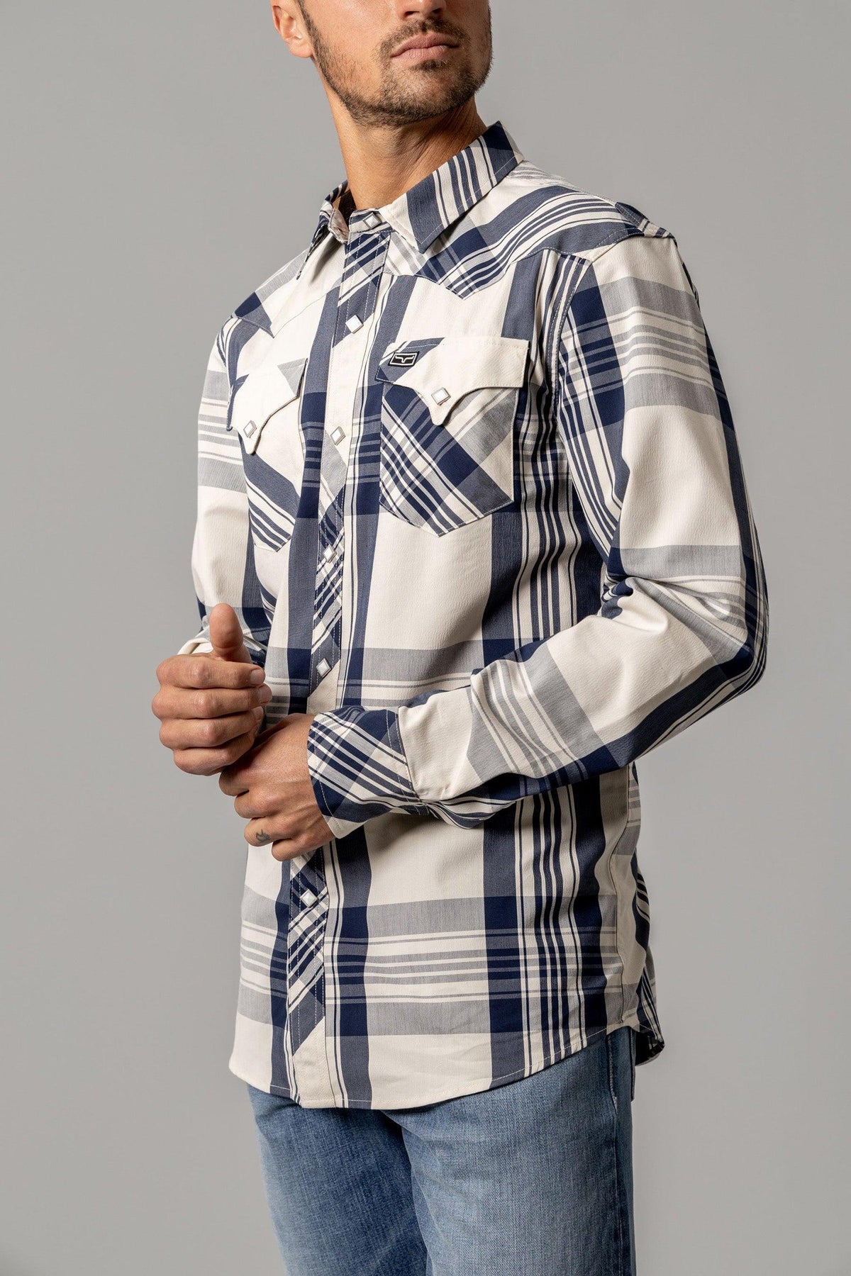 Kimes Ranch Double R long sleeve dress shirt in Navy, side view, with a plaid pattern and two chest pockets