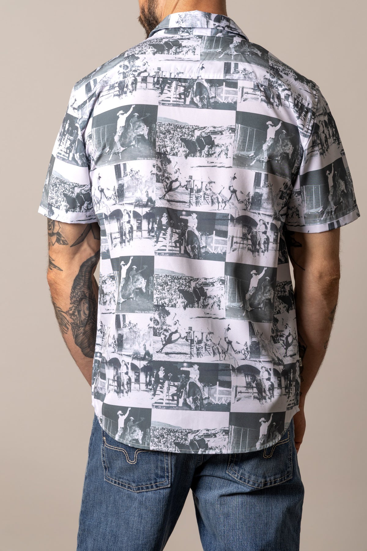 Kimes Ranch Dunn, back view, dress shirt in black and white with a vintage rodeo photo collage print on the back