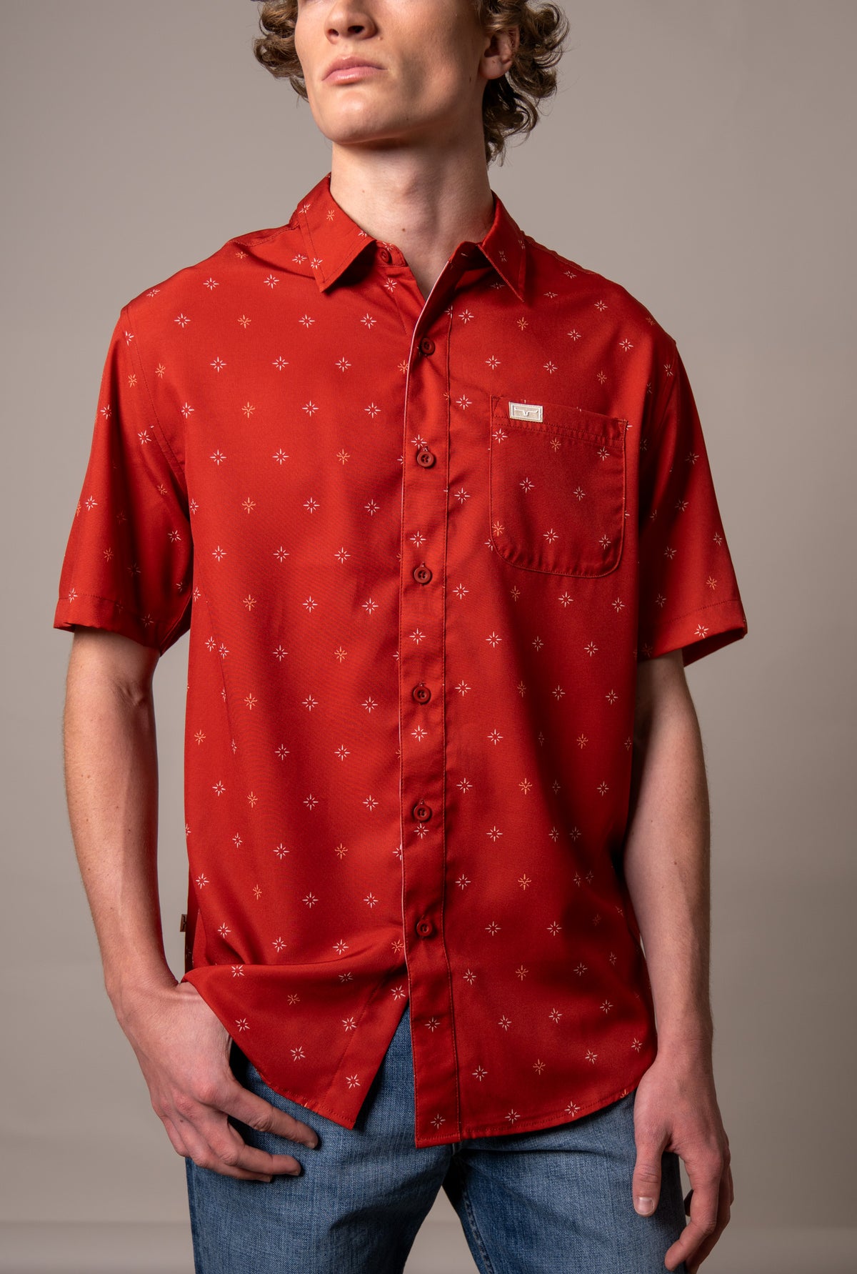 Kimes Ranch Dunn Red short sleeve button up dress shirt with all over star print and chest pocket