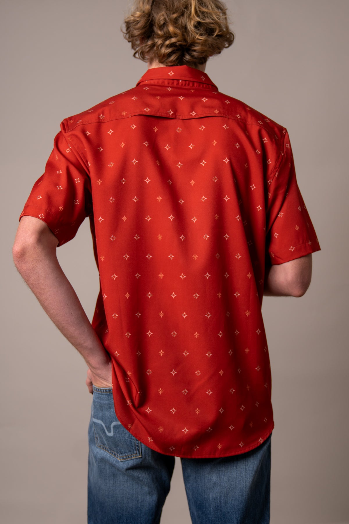 Kimes Ranch Dunn dress shirt in Red, back view, with a small all-over star pattern and a back yoke