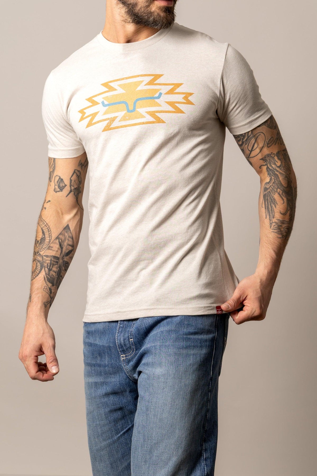 Kimes Ranch Durango shirt in Sand with a yellow and blue lightning bolt graphic on the front