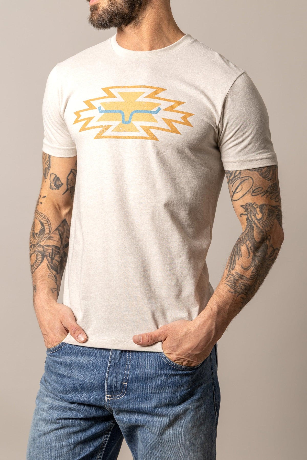 Kimes Ranch Durango shirt in Sand with a yellow and blue lightning bolt graphic on the chest