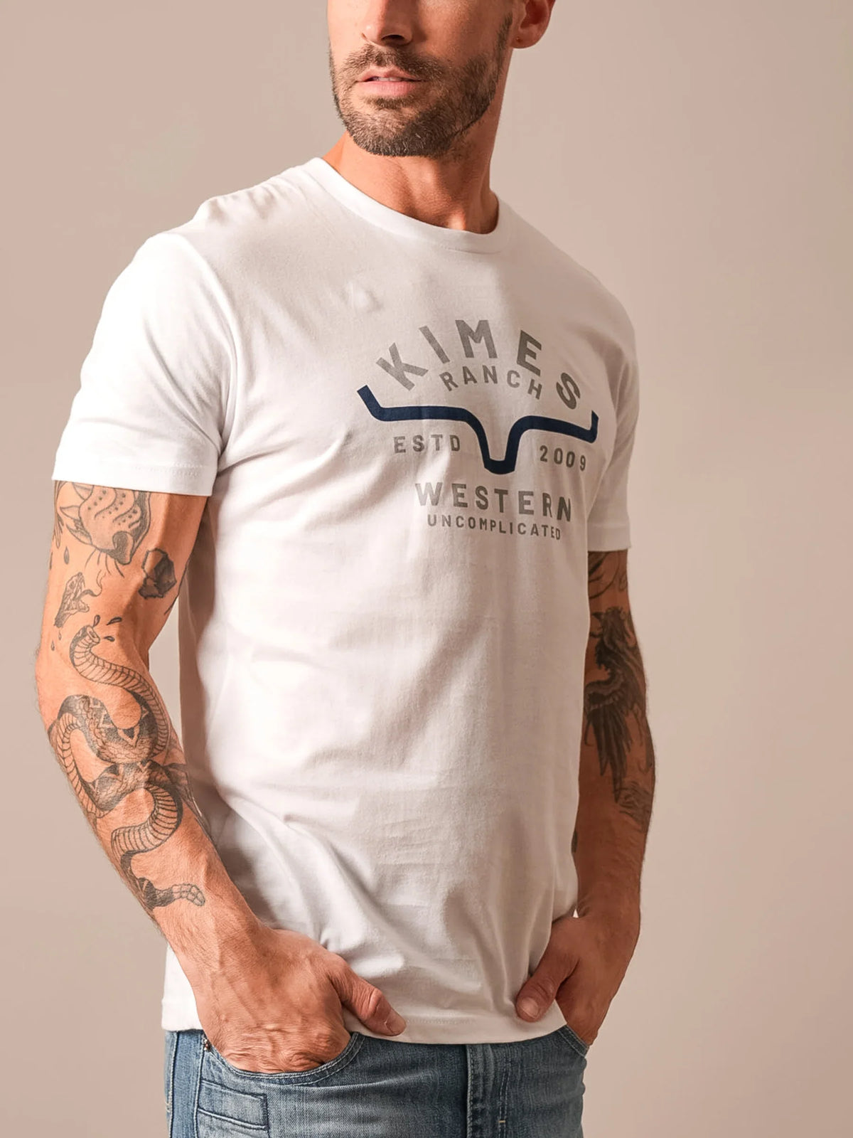 Kimes Ranch Easy Does It White t-shirt with a graphic featuring the Kimes Ranch logo and text reading Western Uncomplicated