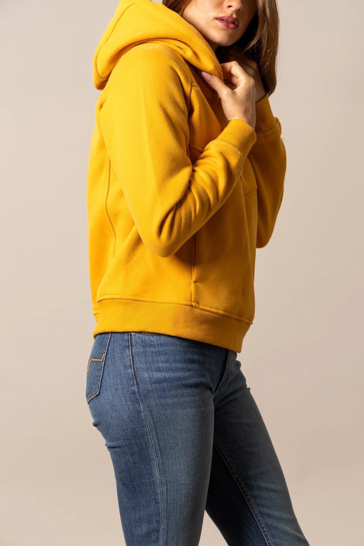 Kimes Ranch Ella hoodie in Yellow Ochre, side view, with a kangaroo pocket and ribbed cuffs