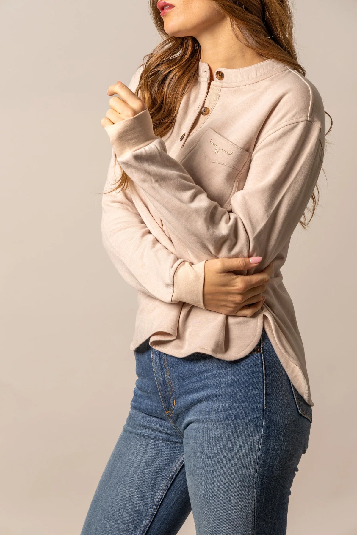 Kimes Ranch Elouise Henley sweater in Natural, side view, with long sleeves and a chest pocket featuring the Kimes Ranch logo