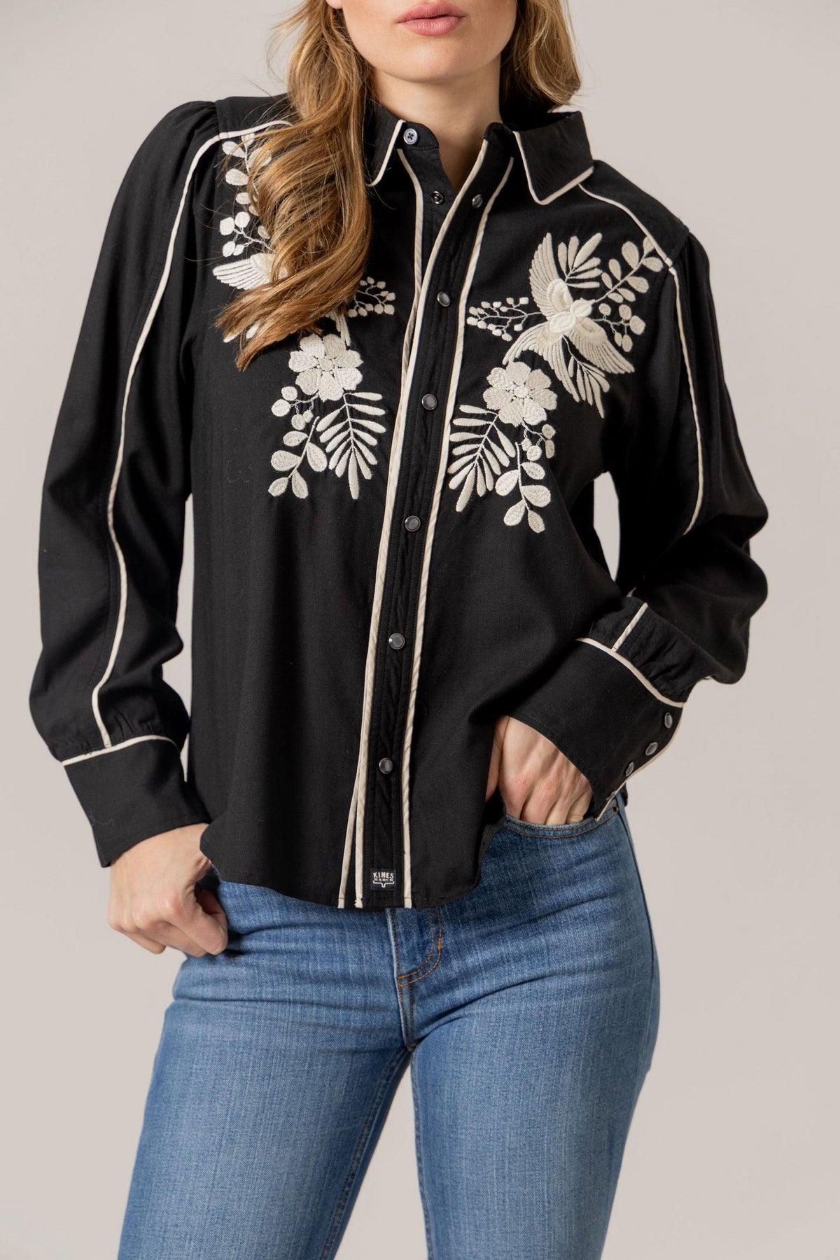 Kimes Ranch Emilia Tencel top in Black with white embroidered birds and flowers and contrast piping