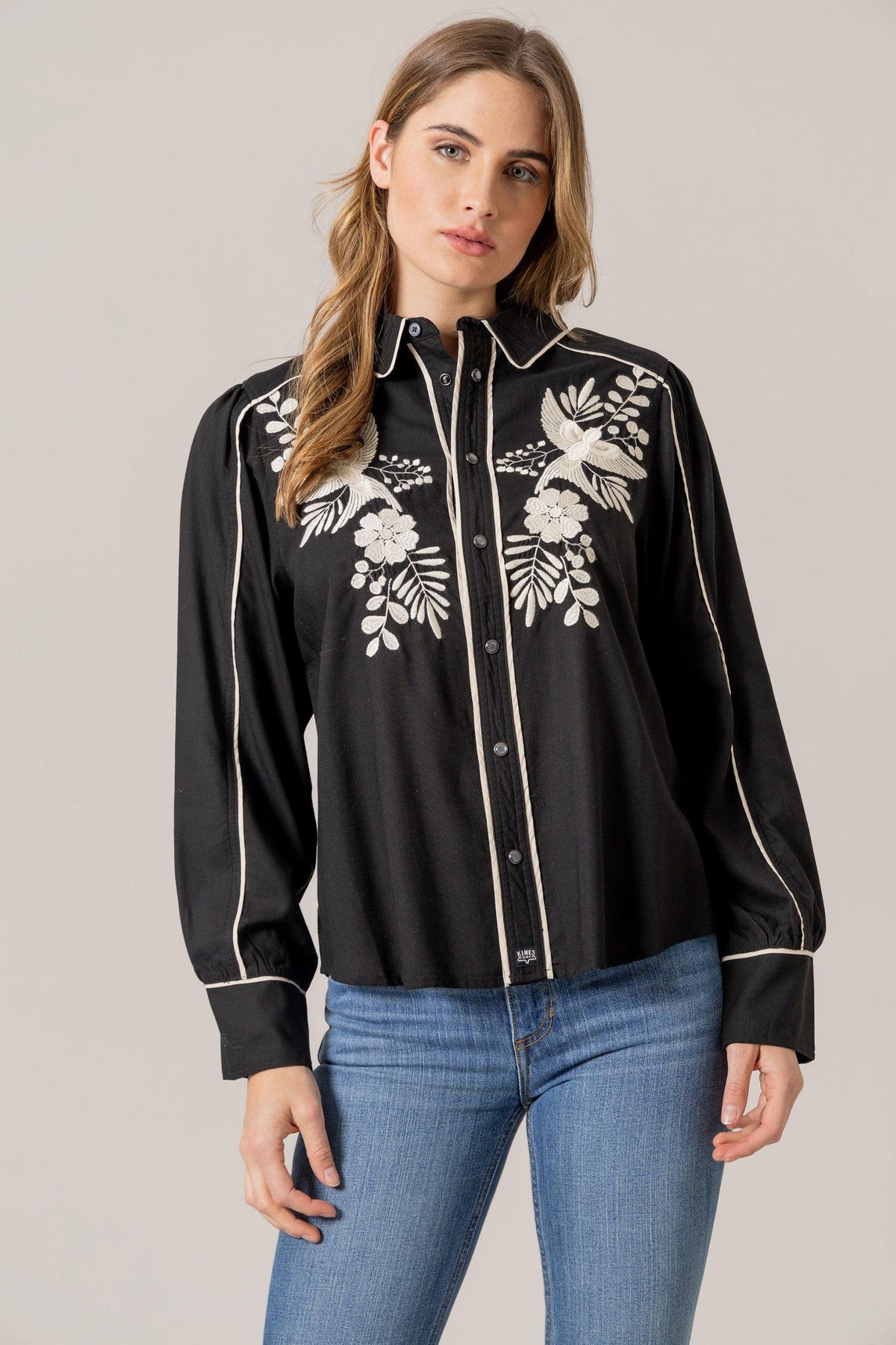 Kimes Ranch Emilia Tencel top in Black with white embroidered birds and flowers and contrast piping