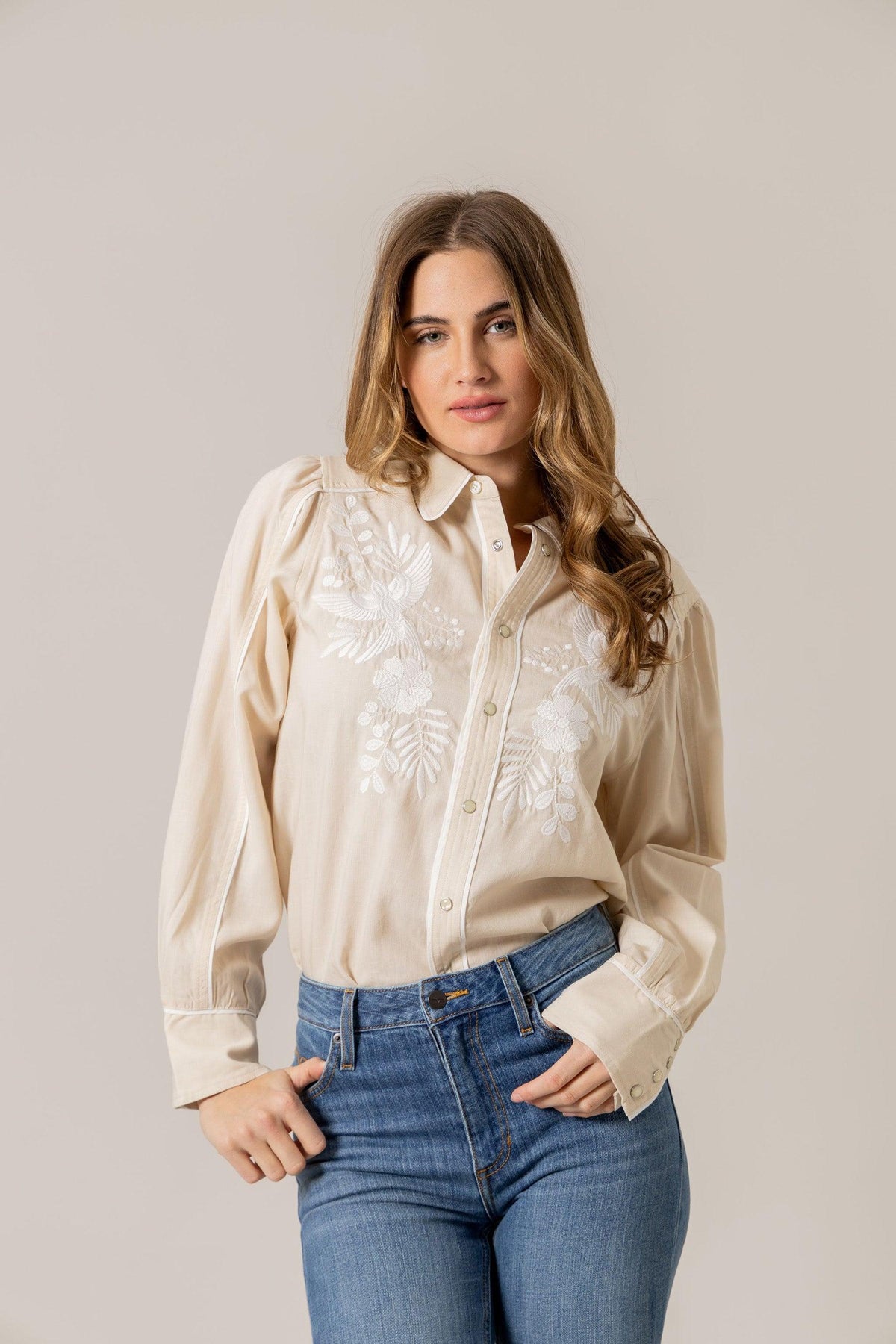 Kimes Ranch Emilia Tencel top in Natural with white floral embroidery on the front and contrast stitching