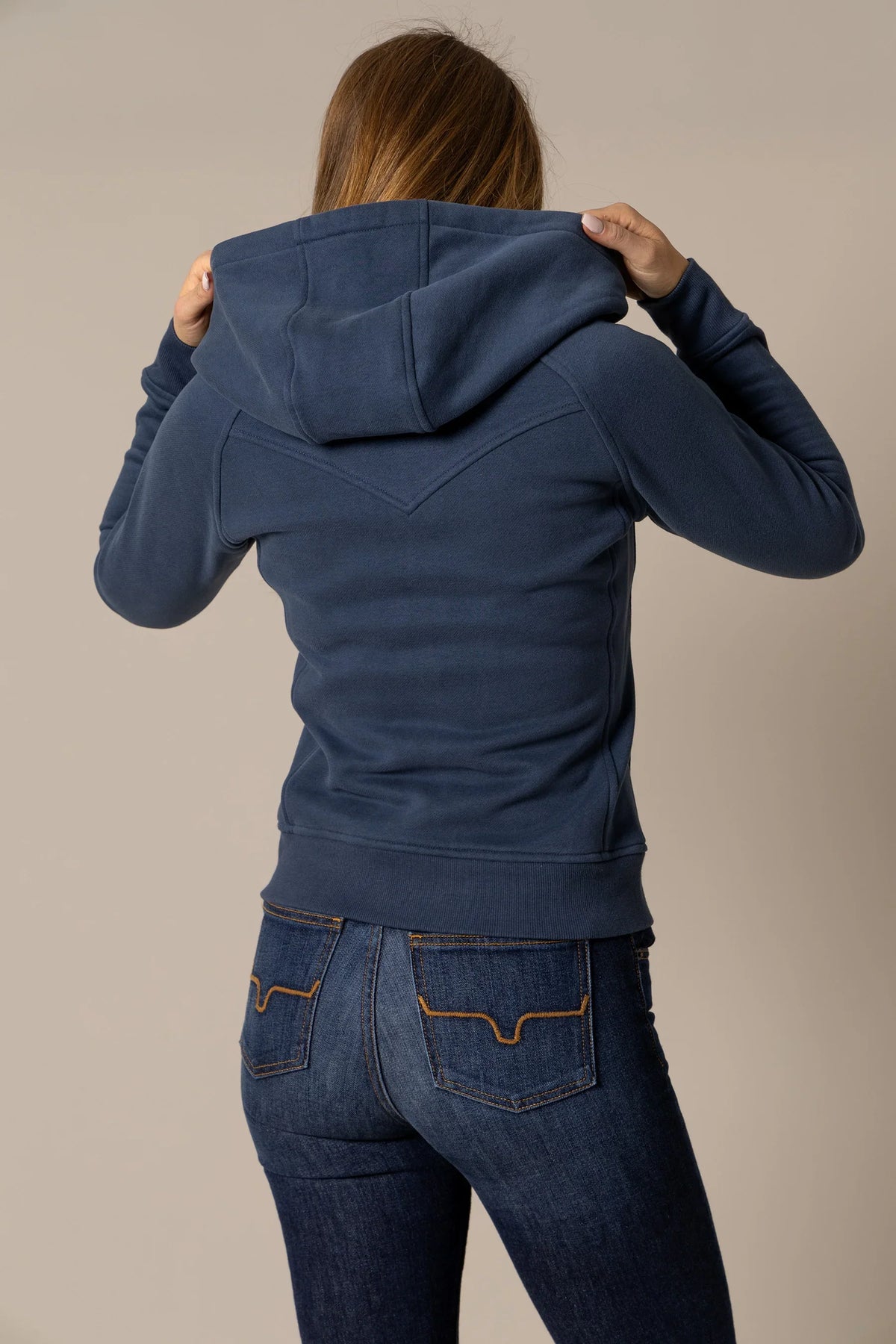 Kimes Ranch Emma Hoodie, back view, in Dark showing the back yoke with contrast stitching and a hood