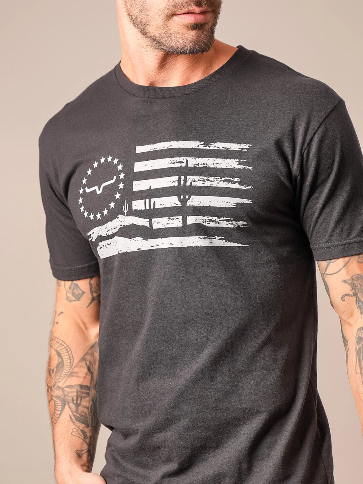 Kimes Ranch Faded shirt in Black with a distressed white flag graphic featuring the Kimes Ranch logo and cacti