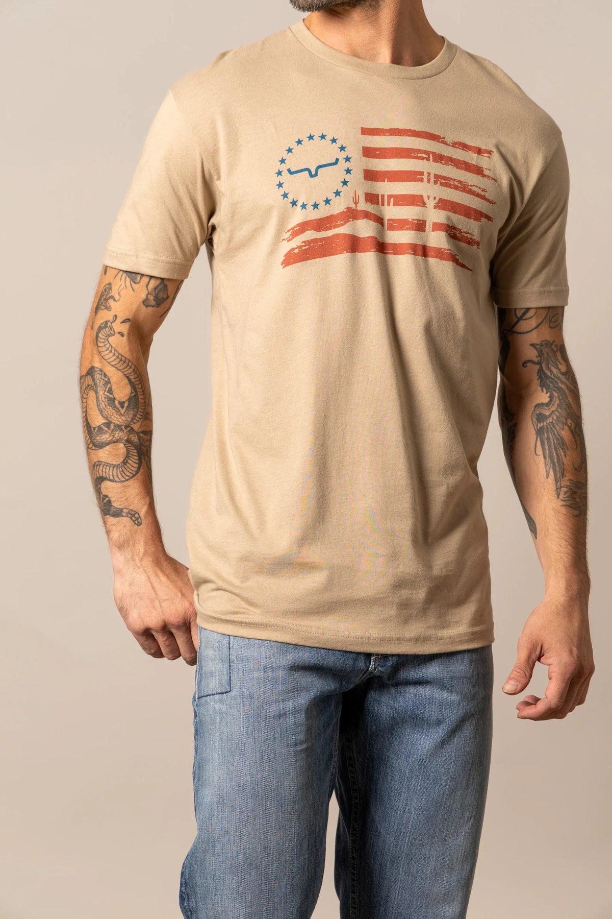 Kimes Ranch Faded Tan short sleeve shirt with a distressed flag graphic featuring a Kimes Ranch logo